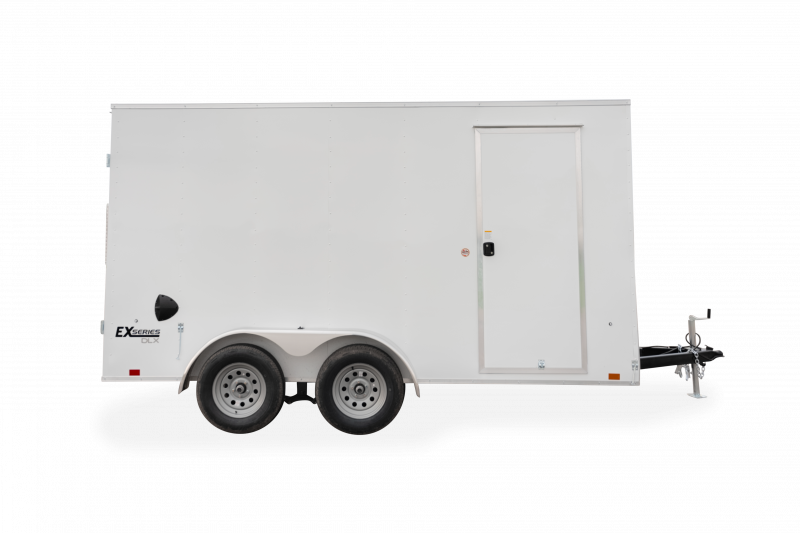 Cargo Express | Trailers | Trailer Models | EX Series DLX | Image of white enclosed cargo trailer with dual axles showing right side of trailer with side door with a clear background
