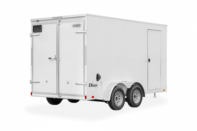 Cargo Express | Trailers | Trailer Models | EX Series DLX | Image of white enclosed cargo trailer with dual axles showing back right of trailer with rear double door and a clear background